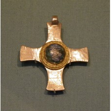 Christian imagery, cross pendant, disc in the center